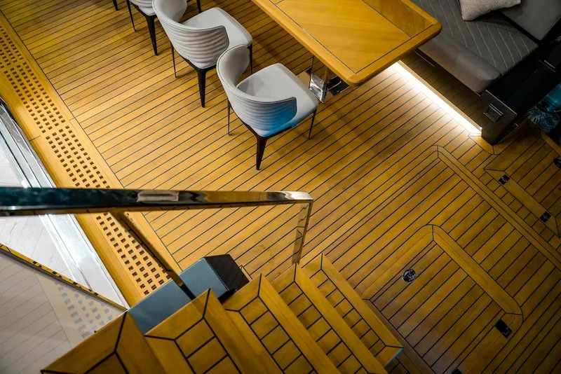 Slide: The Image of 2024 Catamaran Diamond Yachts EF56 interior with wooden flooring and modern seating. - 25