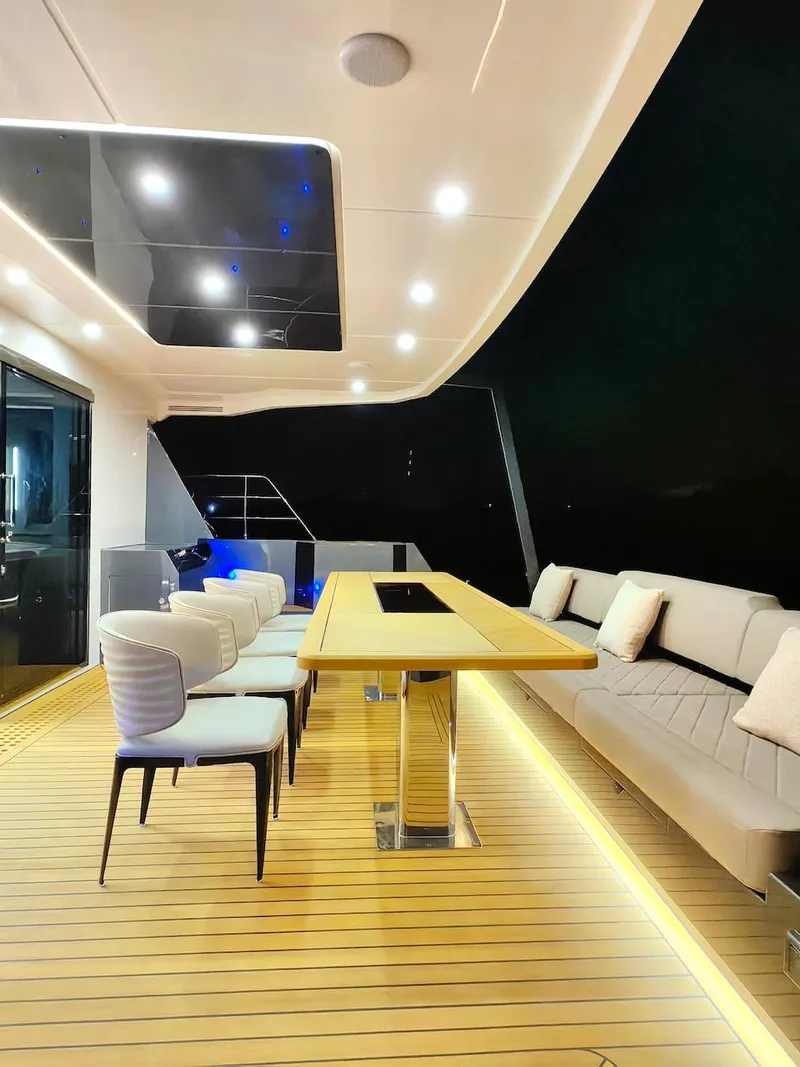 Slide: The Image of Luxurious deck of 2024 Catamaran Diamond Yachts EF56 with modern seating and ambient lighting. - 26