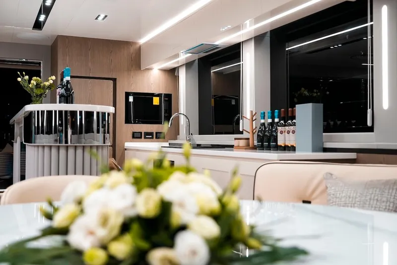 Slide: The Image of Luxurious interior of 2024 Catamaran Diamond Yachts EF56 with modern kitchen and elegant decor. - 28