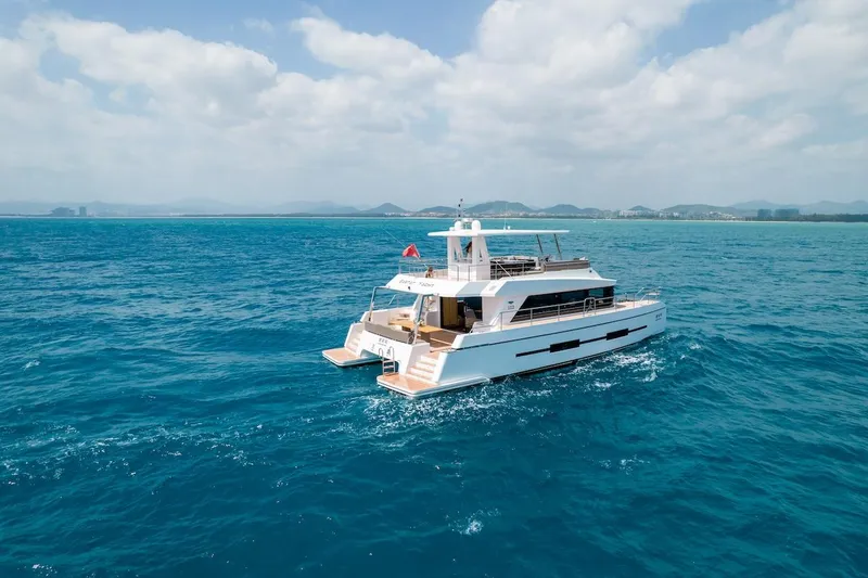Slide: The Image of 2024 Catamaran Diamond Yachts EF56 cruising on open blue sea. - 4
