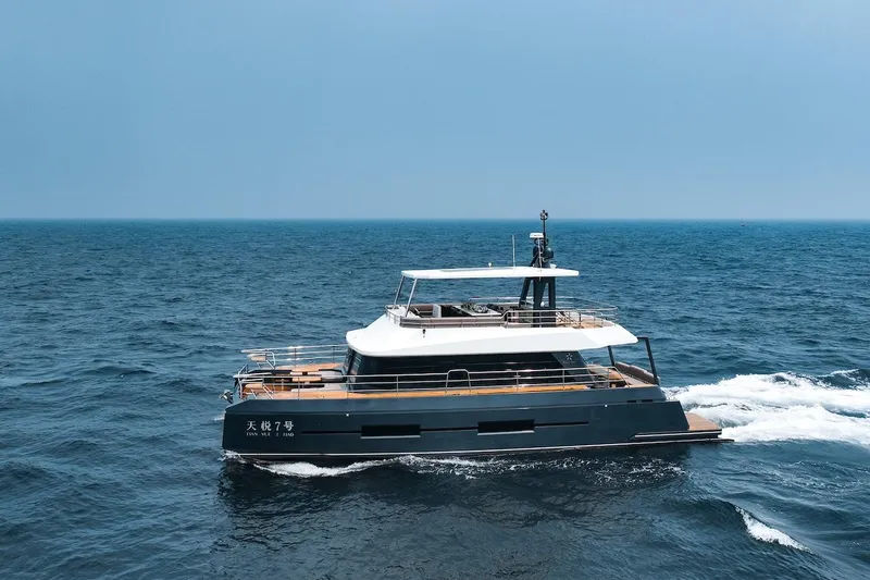 Slide: The Image of 2024 Catamaran Diamond Yachts EF56 cruising on open sea. - 5