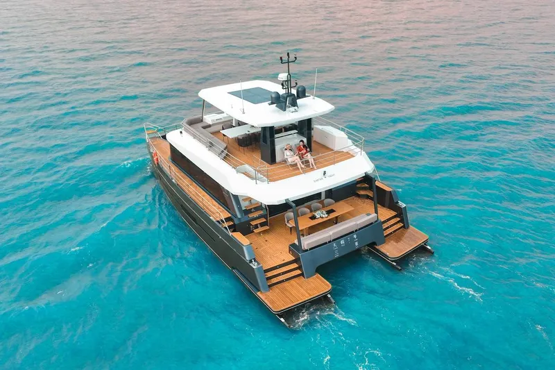 Slide: The Image of 2024 Catamaran Diamond Yachts EF56 cruising on clear blue waters. - 7