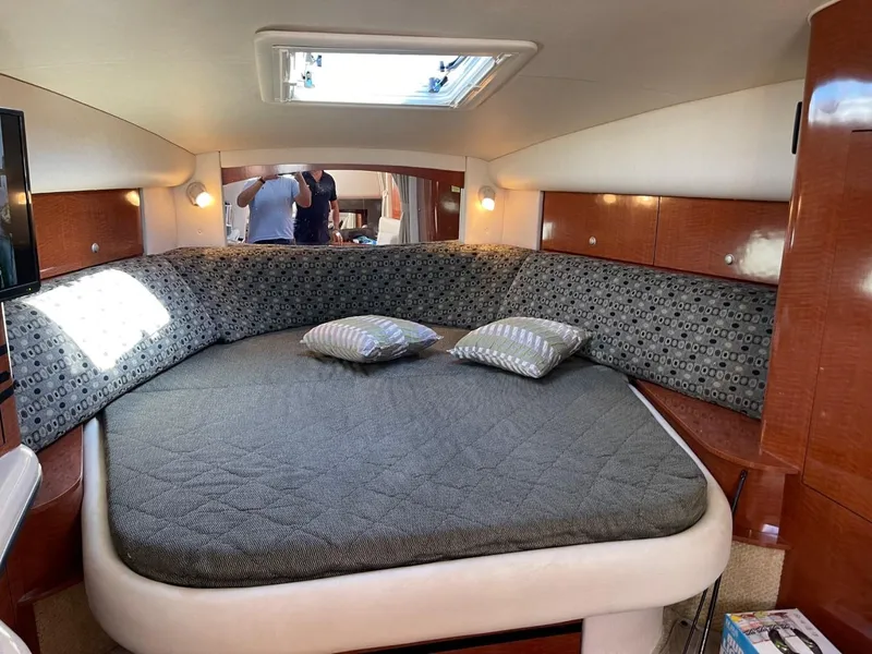 Slide: The Image of Interior cabin of 2005 Sea Ray 320 Sundancer with bed and skylight. - 13