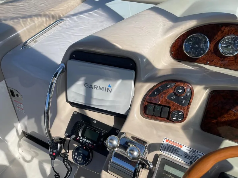 Slide: The Image of Control panel of a 2005 Sea Ray 320 Sundancer with Garmin navigation system. - 8
