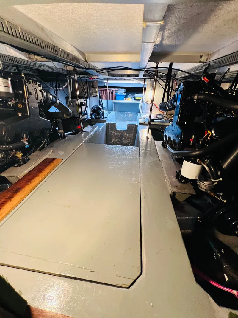 Slide: The Image of Engine room of 1987 Carver 4227 Cockpit Motor Yacht, showcasing mechanical components. - 31