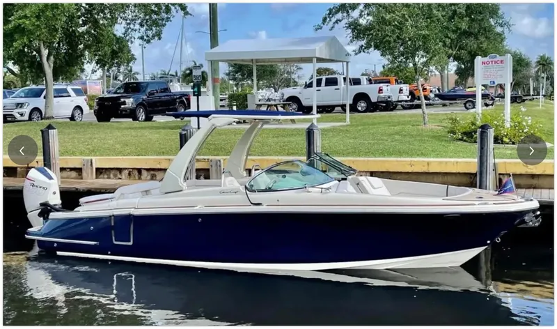 Slide: The Image of 2021 Chris-Craft 28 LAUNCH GT boat docked in a marina. - 0