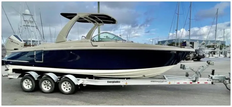 Slide: The Image of 2021 Chris-Craft 28 LAUNCH GT boat on trailer at marina. - 1