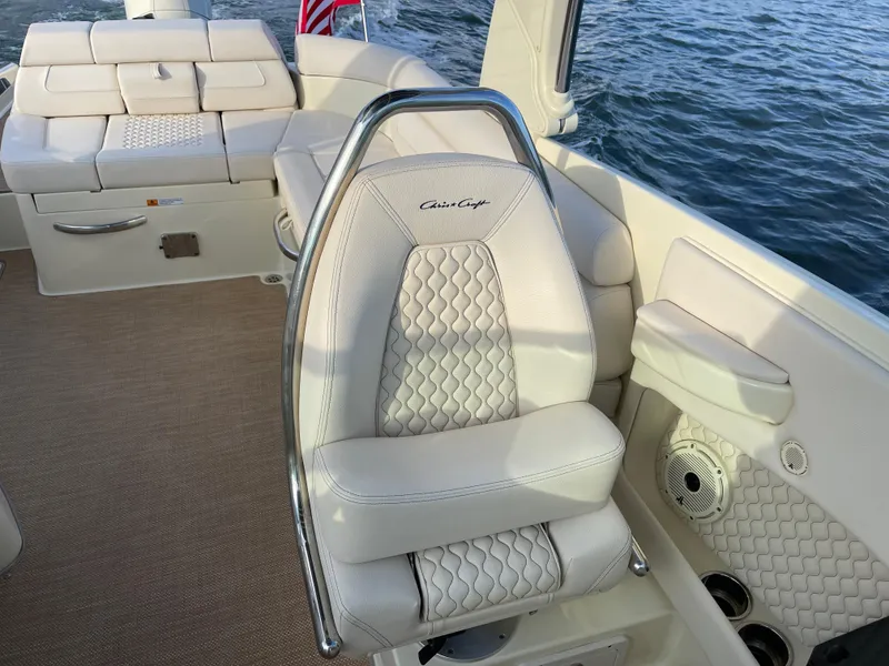 Slide: The Image of 2021 Chris-Craft 28 LAUNCH GT boat interior with luxurious seating and water view. - 14