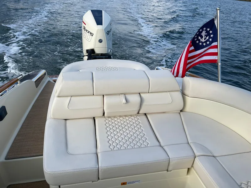 Slide: The Image of 2021 Chris-Craft 28 LAUNCH GT boat with outboard motor and American flag. - 17