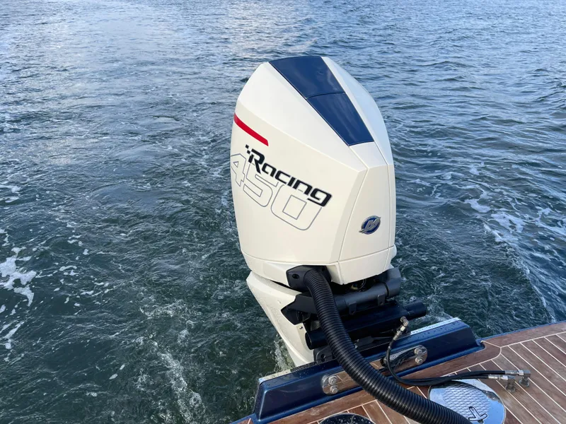 Slide: The Image of 2021 Chris-Craft 28 LAUNCH GT with powerful outboard motor on water. - 18