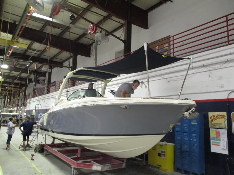Slide: The Image of 2021 Chris-Craft 28 LAUNCH GT boat in a workshop under maintenance. - 19