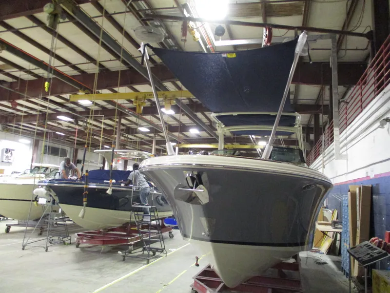 Slide: The Image of 2021 Chris-Craft 28 LAUNCH GT boat in a workshop for maintenance. - 20