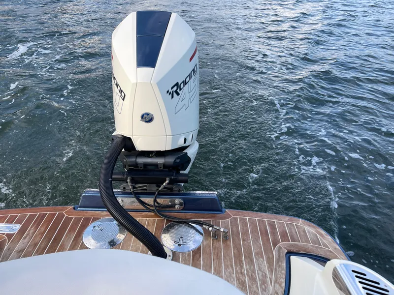 Slide: The Image of 2021 Chris-Craft 28 LAUNCH GT boat with powerful outboard motor on water. - 25