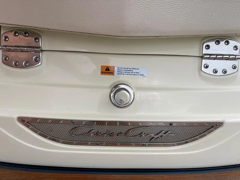 Slide: The Image of 2021 Chris-Craft 28 LAUNCH GT boat rear view with logo and warning label. - 31