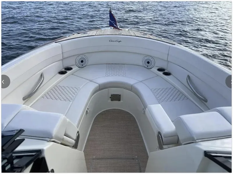 Slide: The Image of 2021 Chris-Craft 28 LAUNCH GT boat interior with white seating and ocean view. - 47