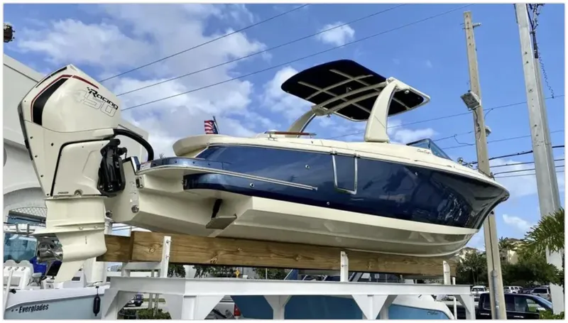 Slide: The Image of 2021 Chris-Craft 28 LAUNCH GT boat on display with outboard motor. - 48