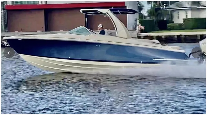 Slide: The Image of 2021 Chris-Craft 28 LAUNCH GT boat cruising on water. - 49