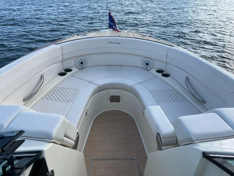 Slide: The Image of 2021 Chris-Craft 28 LAUNCH GT boat interior with white seating and cup holders. - 6