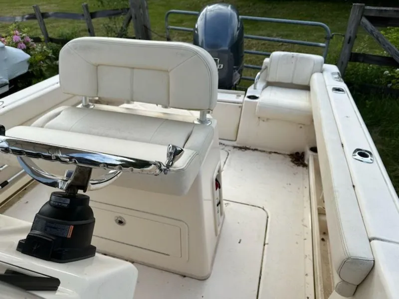 Slide: The Image of 2016 Grady-White 209 Fisherman boat interior with seating and steering console. - 5