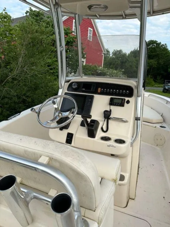 Slide: The Image of 2016 Grady-White 209 Fisherman boat console with steering wheel and navigation equipment. - 7