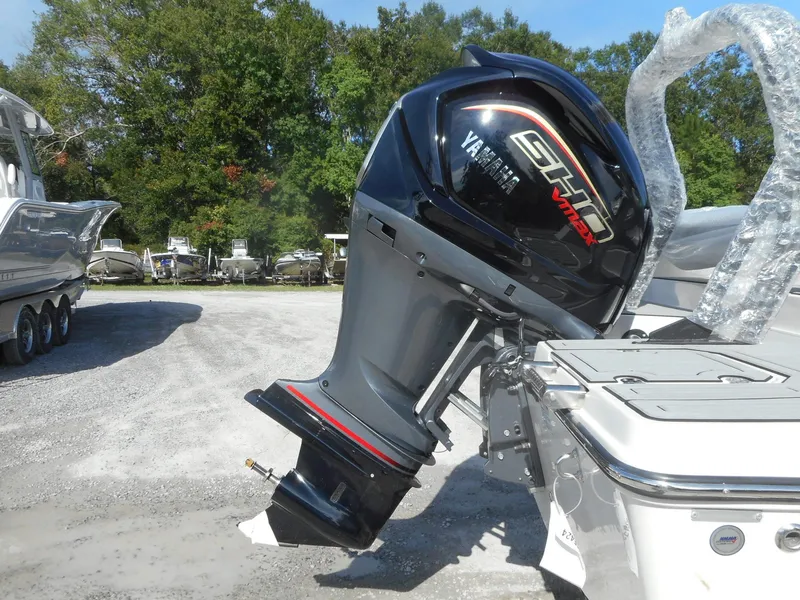 Slide: The Image of 2024 Starcraft SVX 210 OB DC boat with Yamaha outboard motor. - 1