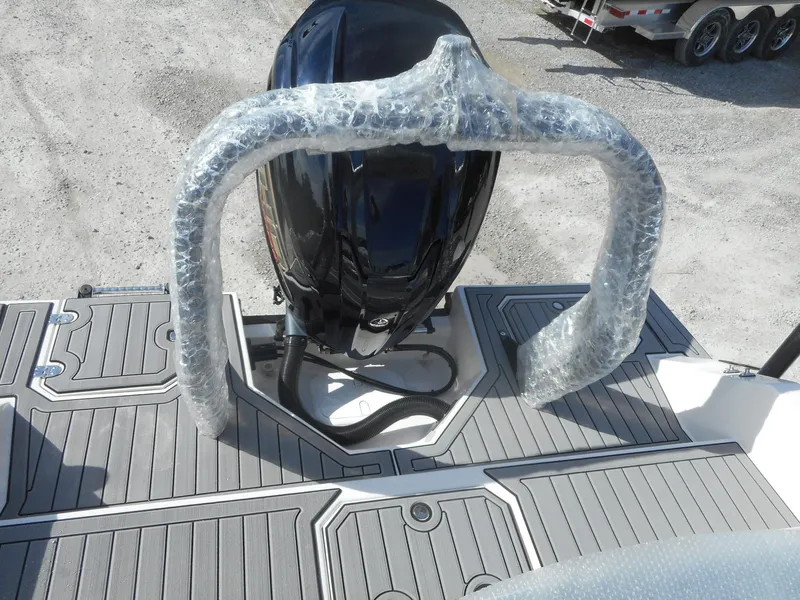 Slide: The Image of 2024 Starcraft SVX 210 OB DC boat with outboard motor and protective wrapping. - 4