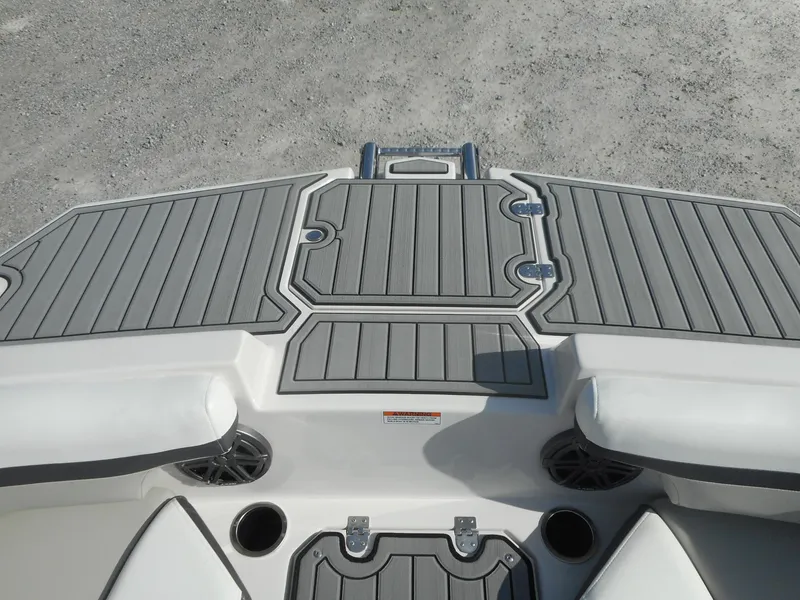 Slide: The Image of 2024 Starcraft SVX 210 OB DC boat deck with gray non-slip surface. - 9