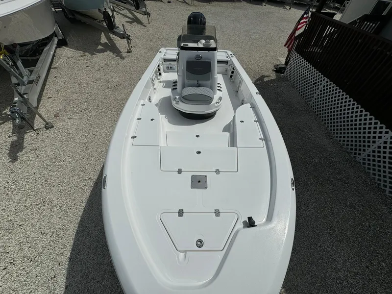 Slide: The Image of 2025 NauticStar 224 Bay boat, top view, white deck, center console. - 7