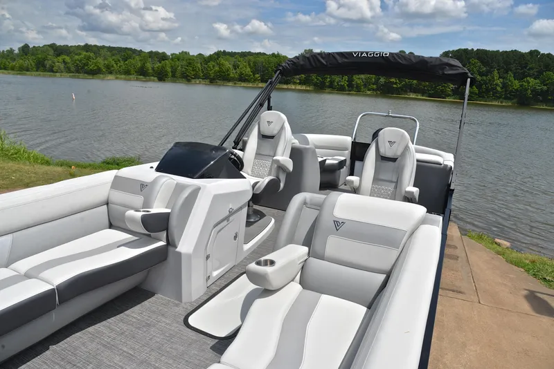 Slide: The Image of 2023 Viaggio Diamante 26 U Platinum pontoon boat on a serene lake. - 22