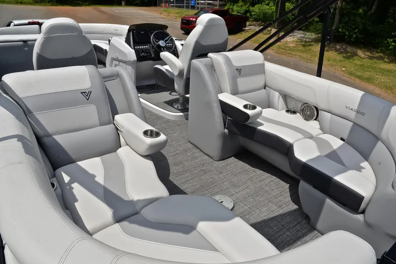 Slide: The Image of 2023 Viaggio Diamante 26 U Platinum boat interior with luxurious seating and modern dashboard. - 25