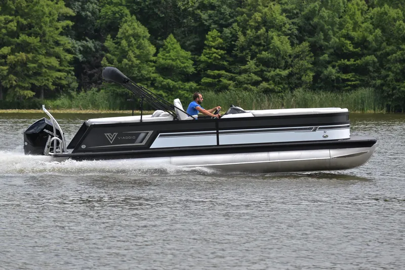 Slide: The Image of 2023 Viaggio Diamante 26 U Platinum pontoon boat cruising on a lake. - 3