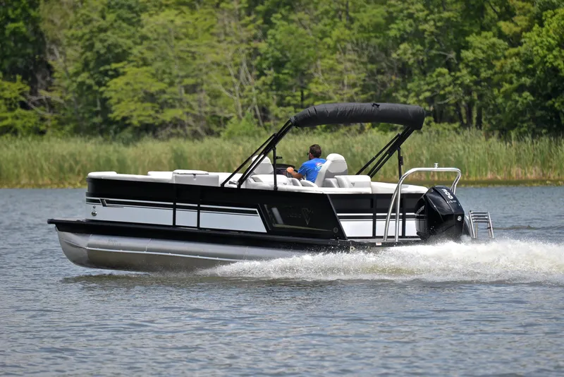 Slide: The Image of 2023 Viaggio Diamante 26 U Platinum pontoon boat cruising on a lake. - 4