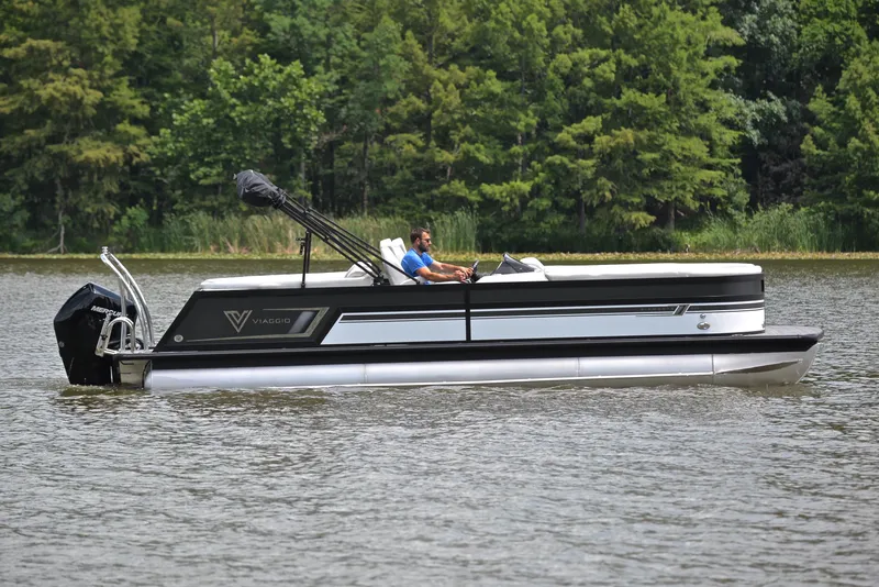 Slide: The Image of 2023 Viaggio Diamante 26 U Platinum pontoon boat cruising on a lake. - 6