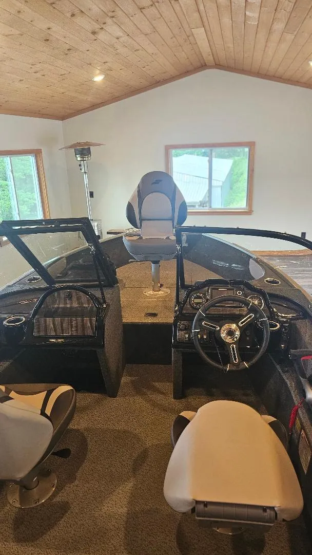 Slide: The Image of Interior of 2025 Starcraft FUSION 16 DC boat with modern seating and controls. - 8