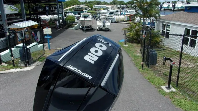 Slide: The Image of 2025 Monterey M 205 boat with Mercury engine in a marina setting. - 10