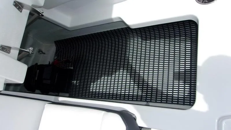 Slide: The Image of 2025 Monterey M 205 boat storage compartment with black grid mat. - 12