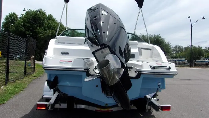 Slide: The Image of 2025 Monterey M 205 boat on trailer, rear view with outboard motor. - 5