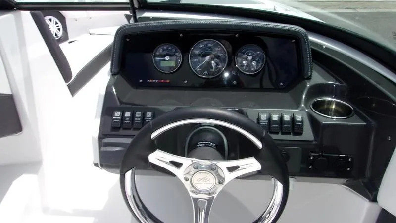 Slide: The Image of 2025 Monterey M 205 boat dashboard with steering wheel and instrument panel. - 6