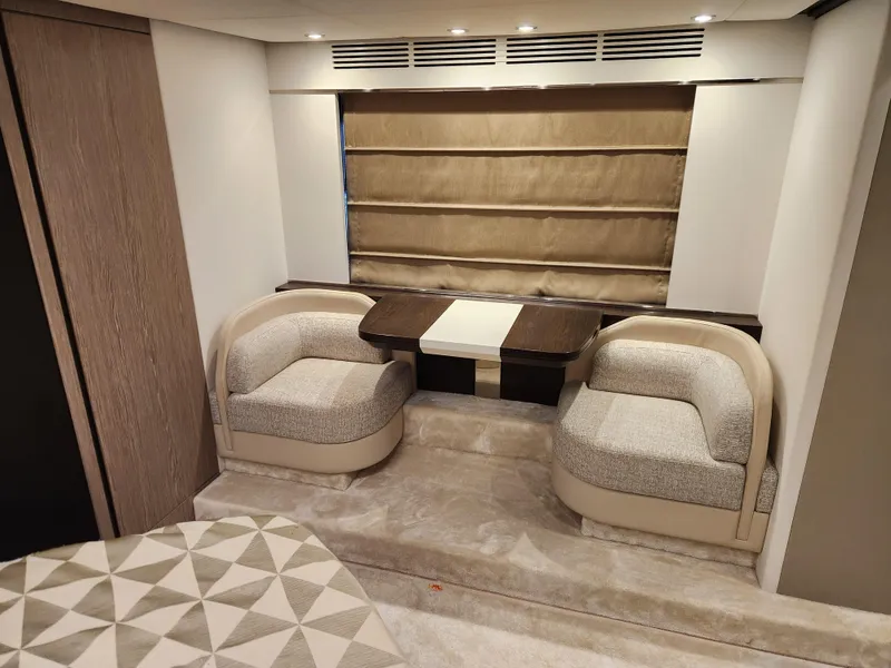 Slide: The Image of Luxurious interior of 2019 Azimut S6 yacht with elegant seating and table. - 12