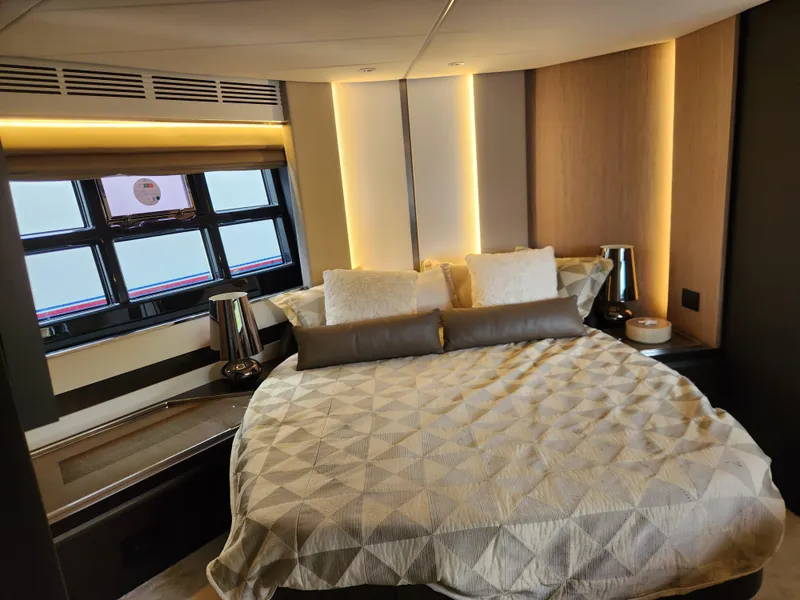 Slide: The Image of Luxurious bedroom interior of 2019 Azimut S6 yacht with modern design and ambient lighting. - 13