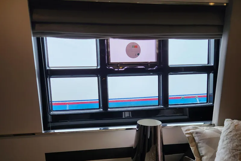 Slide: The Image of Interior view of 2019 Azimut S6 yacht window with modern design elements. - 14