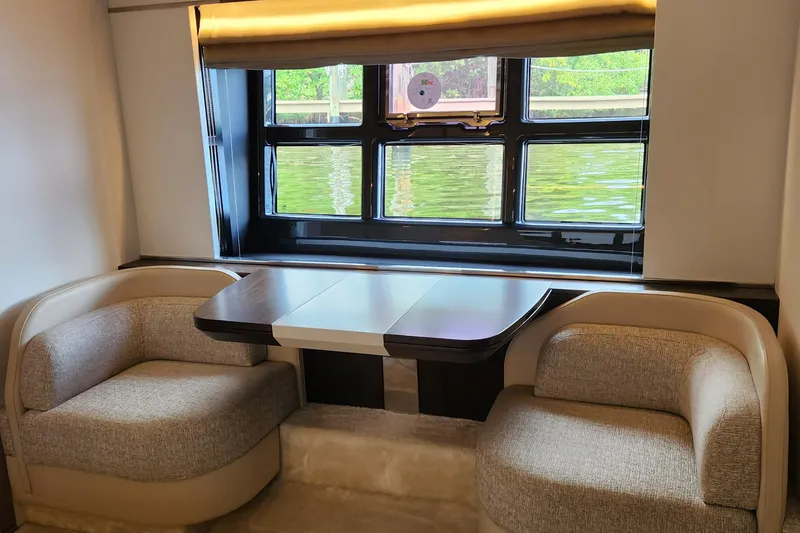 Slide: The Image of Luxurious interior of 2019 Azimut S6 yacht with elegant seating and window view. - 15