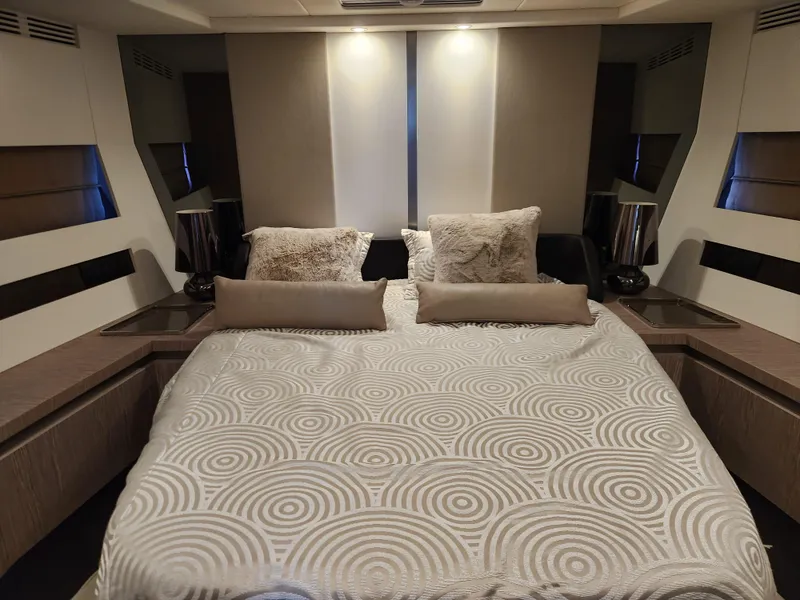 Slide: The Image of Luxurious bedroom interior of 2019 Azimut S6 yacht with modern design and plush bedding. - 19