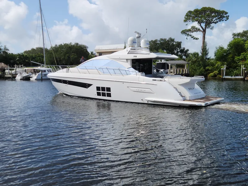 Slide: The Image of 2019 Azimut S6 yacht cruising on a serene waterway. - 2