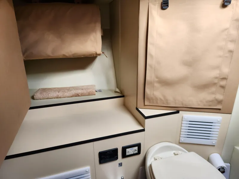 Slide: The Image of 2019 Azimut S6 yacht bathroom interior with beige decor and compact design. - 25