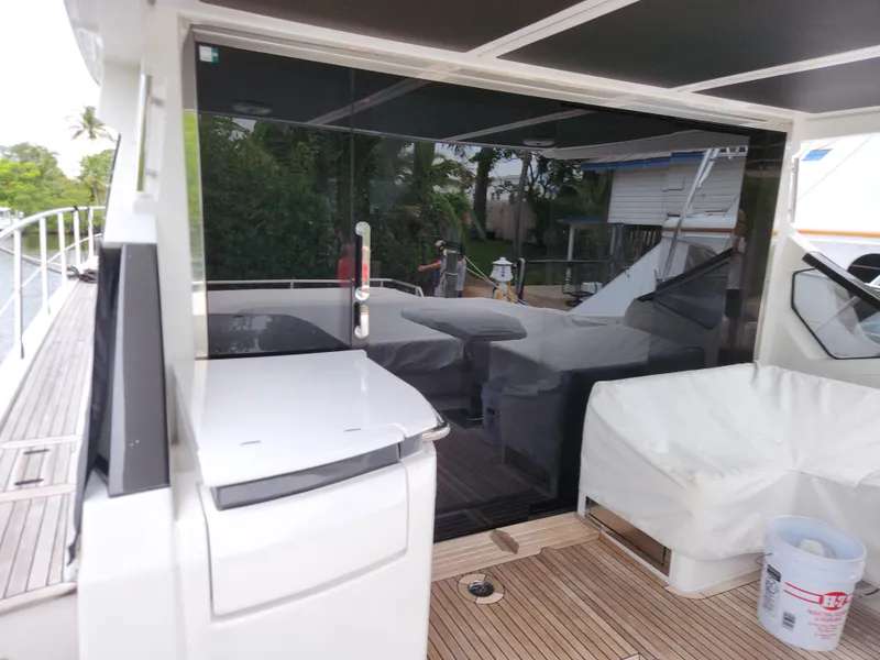 Slide: The Image of 2019 Azimut S6 yacht deck with covered seating and sleek design. - 31