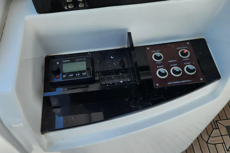 Slide: The Image of Control panel of a 2019 Azimut S6 yacht with various switches and displays. - 32