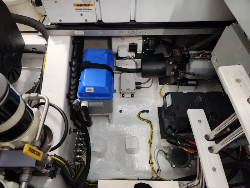 Slide: The Image of Engine compartment of a 2019 Azimut S6 yacht, showcasing electrical components and wiring. - 37