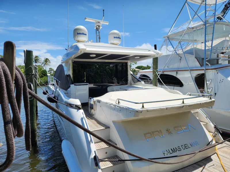 Slide: The Image of 2019 Azimut S6 yacht docked at marina under clear blue sky. - 4
