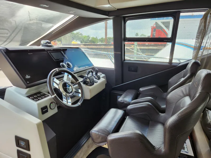 Slide: The Image of Interior of 2019 Azimut S6 yacht cockpit with modern steering and controls. - 5